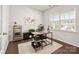 Bright home office features a desk, shelving, and ample natural light at 9613 Fire Bellied Ct, Lancaster, SC 29720