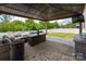 Relaxing outdoor patio with a gazebo, comfortable seating, fire pit, and a well-maintained lawn at 9613 Fire Bellied Ct, Lancaster, SC 29720