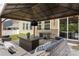 Inviting covered patio with stylish furniture and a sliding glass door leading indoors at 9613 Fire Bellied Ct, Lancaster, SC 29720