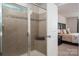 Detailed shot of the shower, with glass doors, and neutral tile at 9613 Fire Bellied Ct, Lancaster, SC 29720