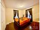 Cozy bedroom with hardwood floors, a double bed, and warm neutral paint at 970 Mt Moriah Church Rd, China Grove, NC 28023