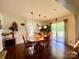 Cozy dining area with hardwood floors, pendant lighting, and sliding glass door at 970 Mt Moriah Church Rd, China Grove, NC 28023