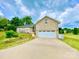 Charming brick home with a two-car garage and well-manicured lawn on a partly cloudy day at 970 Mt Moriah Church Rd, China Grove, NC 28023