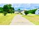 Lovely brick house with a curved front entry, long driveway, and well-kept lawn with trees at 970 Mt Moriah Church Rd, China Grove, NC 28023