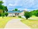 A well-maintained brick home with a large front yard, driveway, and some landscaping at 970 Mt Moriah Church Rd, China Grove, NC 28023