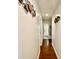Hallway with hardwood floors and decorative wall art at 970 Mt Moriah Church Rd, China Grove, NC 28023