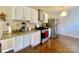 Well-lit kitchen with stainless appliances, granite countertops, and white cabinets at 970 Mt Moriah Church Rd, China Grove, NC 28023