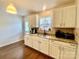 Cozy kitchen featuring granite countertops and white cabinets at 970 Mt Moriah Church Rd, China Grove, NC 28023