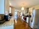 Open kitchen features stainless appliances, granite counters, and hardwood flooring at 970 Mt Moriah Church Rd, China Grove, NC 28023