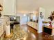 Bright kitchen features granite counters, white cabinetry, and hardwood flooring at 970 Mt Moriah Church Rd, China Grove, NC 28023