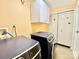 Laundry room featuring side by side washer and dryer and storage cabinets at 970 Mt Moriah Church Rd, China Grove, NC 28023