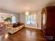Cozy living room with hardwood floors, comfortable sofa, and stylish cabinet at 970 Mt Moriah Church Rd, China Grove, NC 28023