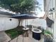 This outdoor patio is perfect for entertaining with a cozy seating area and privacy fence at 9832 Longstone Ln, Charlotte, NC 28277
