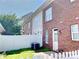 Brick home with a fenced backyard at 9832 Longstone Ln, Charlotte, NC 28277