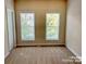Neutral bedroom featuring two windows bringing in lots of natural light at 9832 Longstone Ln, Charlotte, NC 28277