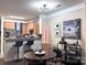 The dining area features modern lighting fixtures, complementing the adjacent kitchen and living spaces at 9832 Longstone Ln, Charlotte, NC 28277