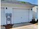 Attached one car garage with white door at 9832 Longstone Ln, Charlotte, NC 28277
