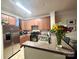 Functional kitchen with stainless steel appliances, ample counter space, and a breakfast bar at 9832 Longstone Ln, Charlotte, NC 28277