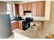 Well-equipped kitchen with a breakfast bar and plentiful cabinet storage at 9832 Longstone Ln, Charlotte, NC 28277