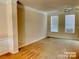 Inviting living space with elegant crown molding and abundant natural light at 9832 Longstone Ln, Charlotte, NC 28277