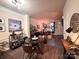 The spacious living room boasts hardwood floors and ample space for both dining and lounging at 9832 Longstone Ln, Charlotte, NC 28277