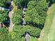 Aerial view of property surrounded by lush trees at 10024 Whitethorn Dr, Charlotte, NC 28277