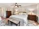 Bedroom features a decorative bed, ceiling fan, and classic style at 10024 Whitethorn Dr, Charlotte, NC 28277