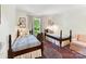 Inviting bedroom with twin beds, classic decor, and a cozy atmosphere at 10024 Whitethorn Dr, Charlotte, NC 28277