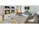 Spacious bonus room with a sitting area, shelving and a small table and chairs at 10024 Whitethorn Dr, Charlotte, NC 28277