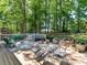 Inviting outdoor deck featuring a dining area and cozy seating, perfect for entertaining at 10024 Whitethorn Dr, Charlotte, NC 28277