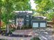 Charming home featuring a two-car garage, brick walkway, manicured lawn, and traditional design at 10024 Whitethorn Dr, Charlotte, NC 28277