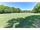 Expansive green space, possibly a golf course, under a clear blue sky at 10024 Whitethorn Dr, Charlotte, NC 28277
