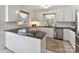 Well-lit kitchen featuring a granite countertop, modern appliances, and ample cabinet space at 10024 Whitethorn Dr, Charlotte, NC 28277