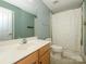 Clean bathroom with a single sink vanity and shower/tub combo, offering functionality and simplicity at 10944 Persimmon Creek Dr, Mint Hill, NC 28227