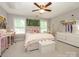 Charming bedroom with natural light, decorative wall decor, and comfortable furnishings that create a cozy space at 10944 Persimmon Creek Dr, Mint Hill, NC 28227
