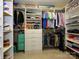 Organized walk-in closet with ample storage space and custom shelving to keep your wardrobe neatly arranged at 10944 Persimmon Creek Dr, Mint Hill, NC 28227