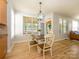 Cozy dining area with hardwood floors and lots of natural light at 10944 Persimmon Creek Dr, Mint Hill, NC 28227