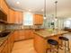 Open kitchen with hardwood floors, granite countertops and stainless steel appliances at 10944 Persimmon Creek Dr, Mint Hill, NC 28227