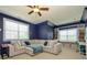 Stylish living room showcasing a large sectional sofa, custom built-ins, and abundant natural light for comfortable living at 10944 Persimmon Creek Dr, Mint Hill, NC 28227