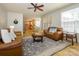 Bright living room with hardwood floors opening to kitchen and dining area at 10944 Persimmon Creek Dr, Mint Hill, NC 28227