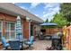 Backyard patio with a dining table, outdoor furniture, and a grill at 11329 Corliss Ave, Charlotte, NC 28277