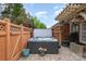 Backyard patio with a hot tub surrounded by a wooden fence at 11329 Corliss Ave, Charlotte, NC 28277