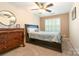 Cozy bedroom with ceiling fan and shuttered window for optimal lighting at 11329 Corliss Ave, Charlotte, NC 28277