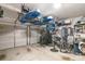 Garage with two vehicle doors, storage, and exercise equipment at 11329 Corliss Ave, Charlotte, NC 28277