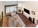 Bright living room with hardwood floors, fireplace and neutral decor at 11329 Corliss Ave, Charlotte, NC 28277
