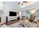 Bright living room featuring a fireplace, high ceilings, and hardwood floors at 11329 Corliss Ave, Charlotte, NC 28277