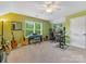 Bedroom with green walls and musical instruments at 11727 Dunham Dr, Matthews, NC 28105