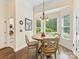 Charming breakfast nook with wood table and views of the backyard at 11727 Dunham Dr, Matthews, NC 28105