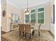 Bright dining room with natural light, elegant table setting, and stylish decor at 11727 Dunham Dr, Matthews, NC 28105