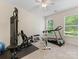 Gym equipment in room with carpet and two windows at 11727 Dunham Dr, Matthews, NC 28105